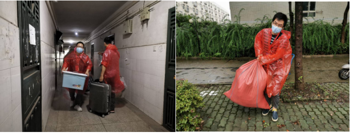 (图为学院教师冒着风雨为员工搬运行李)